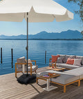 Fillable Black Sand Bags 2 Pack 44 Lbs Each For Umbrella Bases And Patio Furniture Weights Waterproof 800D Oxford Cloth Construction Heavy Duty Sand Bags For Outdoor Cantilever Umbrella Stands Without Sand on a waterfront deck with patio seating