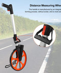 Pissente Hand Measuring Wheel, 0-9999.9ft Mechanical Counter on a road, showcasing its lightweight design and handle.