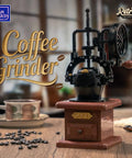 Front view of Vintage Hand Crank Coffee Grinder Building Blocks Set With Moving Gears on a table with coffee beans and cup.