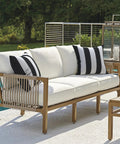 Two Pack Waterproof Outdoor Throw Pillows With Inserts 18x18 Square Cushions For Patio Deck Garden Or Home Furniture Cabana Black All Weather Decor For Sofa Bench And Lounge, displayed on a white sofa in outdoor setting.