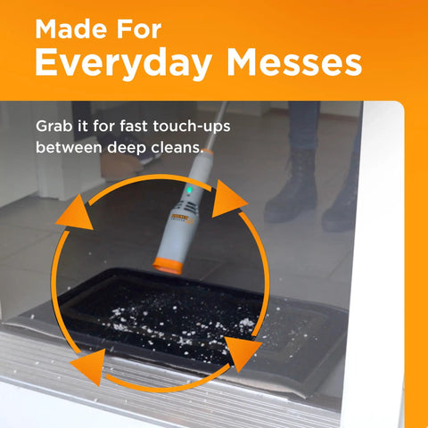 Rocket Cordless Air Broom used for cleaning near doorway, lightweight design for indoor and outdoor cleaning.