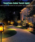 Outdoor Solar Torch Lights With Flickering Flame, Waterproof Garden Landscape Pathway Lights illuminating a curved pathway.