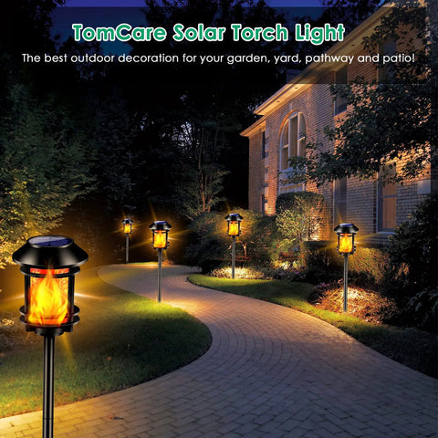 Outdoor Solar Torch Lights With Flickering Flame, Waterproof Garden Landscape Pathway Lights illuminating a curved pathway.