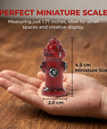 Hand holding 1.77 inch Mini Fire Hydrant Set With Dope Resin Fire Extinguisher Models for dollhouse decor and crafts.