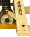 Heavy Duty Hi Viz Yellow Pallet Truck Wheel Chock Delivers Sweet Grip On Concrete handles rough workloads beside wheel.