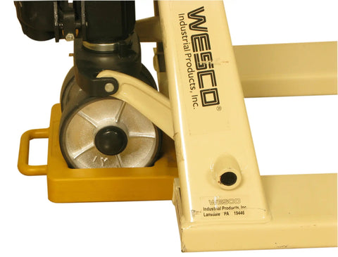 Heavy Duty Hi Viz Yellow Pallet Truck Wheel Chock Delivers Sweet Grip On Concrete handles rough workloads beside wheel.
