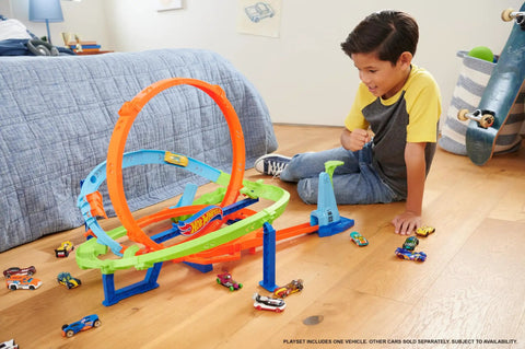 Child playing with Action Loop Cyclone Challenge Car Track Set With Boomerang Loops, 18 Inch Tall Raceway, two play modes, easy storage.