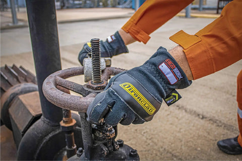 Person wearing Heat Worx Heavy Duty FR Fire Resistant Gloves For Handling Hot Stuff Up To 600°F, NFPA 2112 Certified, grip on valve.
