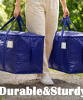 Person carrying two blue Heavy Duty Moving Bags 6 Pack Large Storage Bags With Zipper And Handles Waterproof Tote Bags