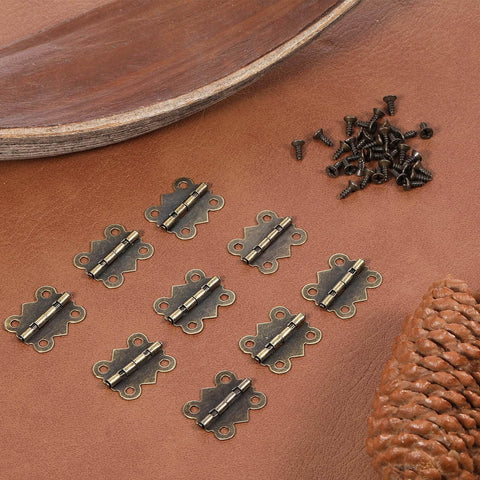 12 Pcs Small Butterfly Hinges Antique Bronze Mini Metal Hinges 20 x 17mm For DIY Wooden Jewelry Boxes Cabinets Crafts With 48 Tiny Screws Durable Iron Construction displayed on leather surface