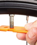 Bike Wheel Care Kit Black For All Bikes With High Quality Cleaning Brushes Degreaser Lubricant And Easy Install Tools shown in use