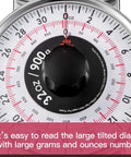 Close-up of 2 Pound Analog Food Scale With 32 Ounces Capacity dial showing grams and ounces measurements.
