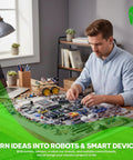 Man assembling robots with Ultimate Arduino Starter Kit With Five Main Boards And 100 Plus Parts For IoT And Smart Robot Projects