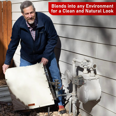 Man placing Cold Weather Backflow Insulation Cover for Outdoor Sprinklers, 40x40 Inches, over pipes against a house wall.