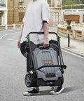 Person carrying Walk-Behind Hand Push Floor Sweeper With A 25.6 Inch Sweep Width, Manual Non Electric Cleaning Machine, 5 Gallon Waste Container