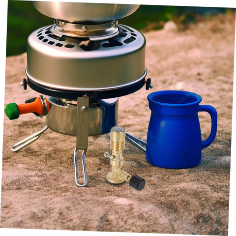 Outdoor setup with Flame Bunsen Burner Portable Gas Blowtorch Head For Propane Cooking Stove, metal stove, and blue mug on rock