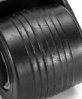 Close-up of Two Pack Black Right Angle Fixed Casters With L Bracket Plates Non Swivel Rubber Wheels showcasing textured surface for grip.
