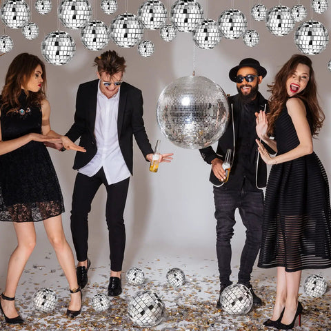 People dancing under 65 Piece Disco Ball Decorations Set With Mini Reflective Mirror Balls In Silver, Foam Core With Sequin Shine