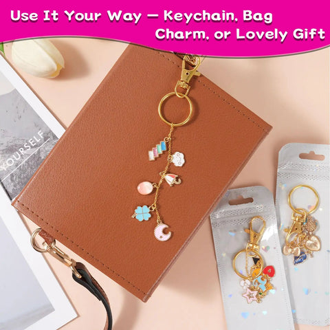 All In One Lip Gloss Keychain Making Kit with 100 Enamel Charms shown with beaded keychain on a brown notebook