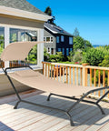 Beige Hanging Hammock Chair With Stand And Canopy for Patio Chillin Cushions and Pillow Included on a sunny porch.