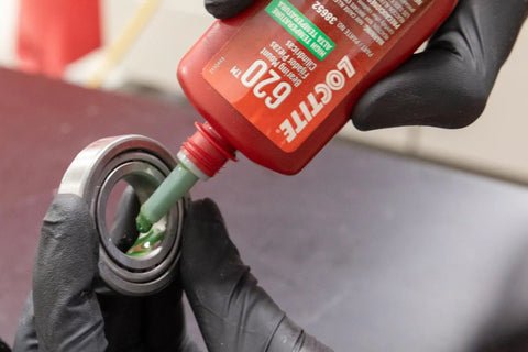 Built Tough High Temperature Bearing Mount Adhesive Liquid Retaining Compound Shop Approved Thick Formula Straight To The Point Engine Rebuild Fix 36 ML Application Bottle applied to a bearing assembly.