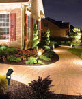 Low Voltage LED Landscape Lights 7W 12V Outdoor Garden Pathway Spotlight Kit With Connectors Six Pack illuminating a curved garden path