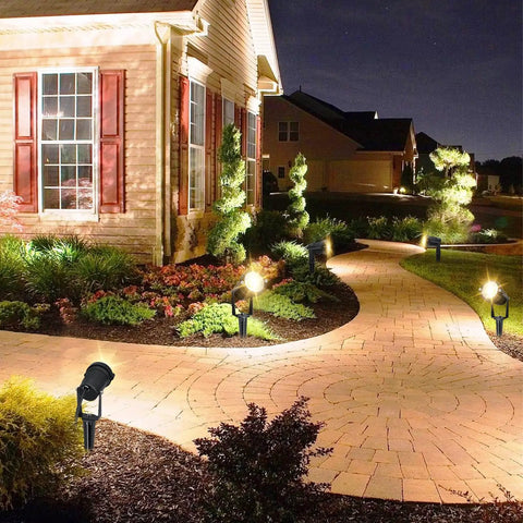 Low Voltage LED Landscape Lights 7W 12V Outdoor Garden Pathway Spotlight Kit With Connectors Six Pack illuminating a curved garden path
