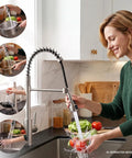 Kitchen Faucet with Glass Rinser & LED Temperature, Pull Down Sprayer in a modern kitchen, woman rinsing fresh vegetables.