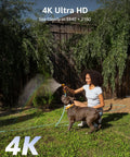 Woman watering garden with dog, showcasing 4K Ultra HD clarity, related to 4K 16 Channel Home Security System With Outdoor Weatherproof Cameras