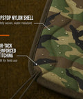 Close-up of Woobie Blanket Insulated Water Resistant Poncho Liner showing camo pattern, ripstop nylon, and reinforced stitching.