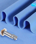 Rotary blade drive housing with metal shaft and gold gear on blue fabric background