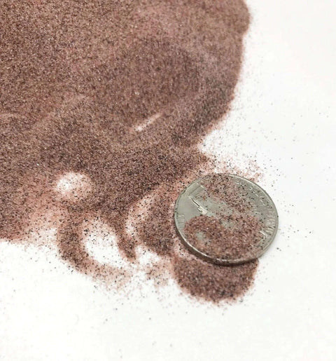 Garnet abrasive media, 100/120 grit, fine grade, brown loose blast grit with dime for scale