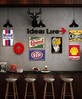 Kickass Vintage Metal Tin Signs Set Of Six Retro Garage Wall Decor featuring Mobil, Castrol, Shell prints on wall.