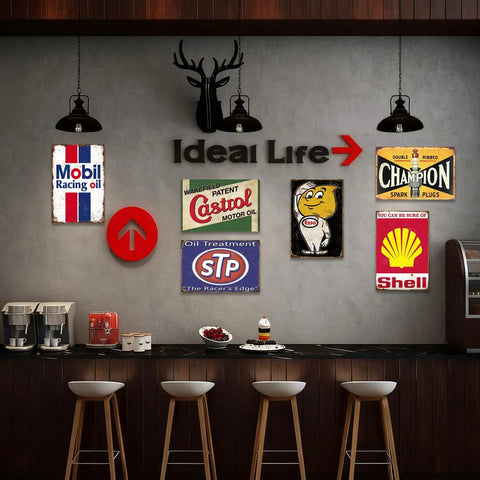 Kickass Vintage Metal Tin Signs Set Of Six Retro Garage Wall Decor featuring Mobil, Castrol, Shell prints on wall.