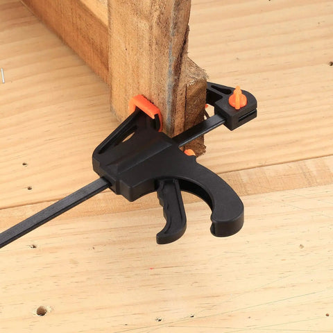 4 Inch Bar Clamps For Woodworking 5 Piece Trigger Quick Grip Clamps With One Handed Ratchet securing wood on workbench