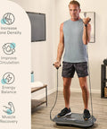 Man using Waver Vibration Plate Exercise Machine With High Intensity Full Body Vibration For Muscle Activation, Loop Bands for workout