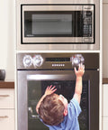 Child reaching for stove with Stove And Oven Knob Safety Cover Set L730A Five Count Pack Easy To Install Kid Safe Kitchen Accessory Clear