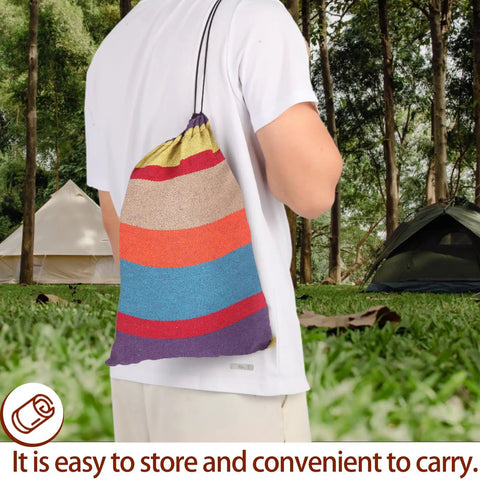 Man holding carry bag of Heavy Duty Camping Hammock With 616 Lbs Weight Capacity Portable Outdoor Indoor Hammock With Carry Bag