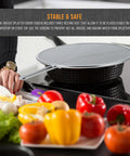 Person placing Three Sizes Stainless Steel Splatter Screen Set With Resting Feet 13 Inch 11.5 Inch And 9.5 Inch over pan