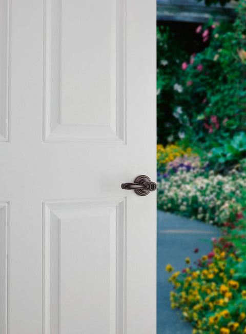 Ashfield Entry Door Handle With Lock And Key For Front Doors And Bedrooms in Venetian Bronze Finish on white door