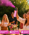 Sick Vibes Pink Smoke Bomb Powder Spray Launcher Kit For Outdoor Raves And Festivals Featuring Hella Biodegradable Color Burst in use at a lively party.