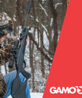 Hunter holding Swarm Magnum 10X GEN3i Inertia Fed Break Barrel.22 Caliber Pellet Rifle With 10 Shot Magazine in snowy woods