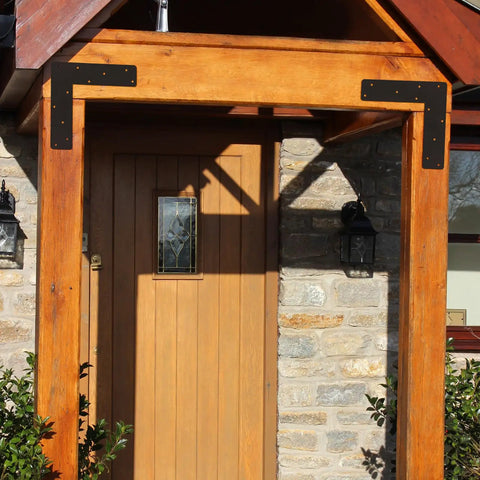 Heavy Duty L Shape Bracket Set, 4 Pcs 12x12 Mending Plates With Black Powder Coat installed on entrance truss framing