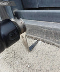 Pneumatic Windshield Removal Knife for auto glass sealant cutter with L-shaped access in use on concrete surface close-up