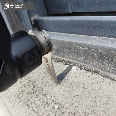 Pneumatic Windshield Removal Knife for auto glass sealant cutter with L-shaped access in use on concrete surface close-up