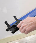Person installing ProSkim Handle Bracket Clamp On For Drywall Finishing Tool With All Angle Adjustment Fits ProSkim Blade