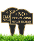 Hefty No Trespassing Signs 2 Pack Private Property Stakes Rock Solid Aluminum in grass, UV resistant, weatherproof design.