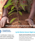 Hands planting tree sapling, promoting ClimatePartner certified Lyridz Motion Sensor Night Light initiative for environmental impact.