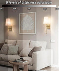 Wireless Battery Operated Wall Sconce Set Of Two With White Fabric Shade Remote Control No Wiring Dimmable Indoor Bedroom Vanity Lighting Bulbs Included Easy Setup Modern Slim Design, shown on wall above couch with adjustable brightness.