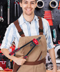 Man holding Ultra Sturdy 14 Inch Rivet Nut Tool Kit with 6 Mandrels and 60 Rivnuts in a workshop setting.